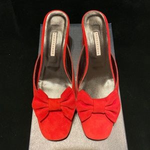 European designer Dora Temur red suede slides.